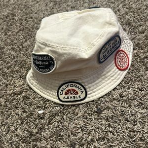 Cream, forever, 21 bucket hat with different beachy stamps